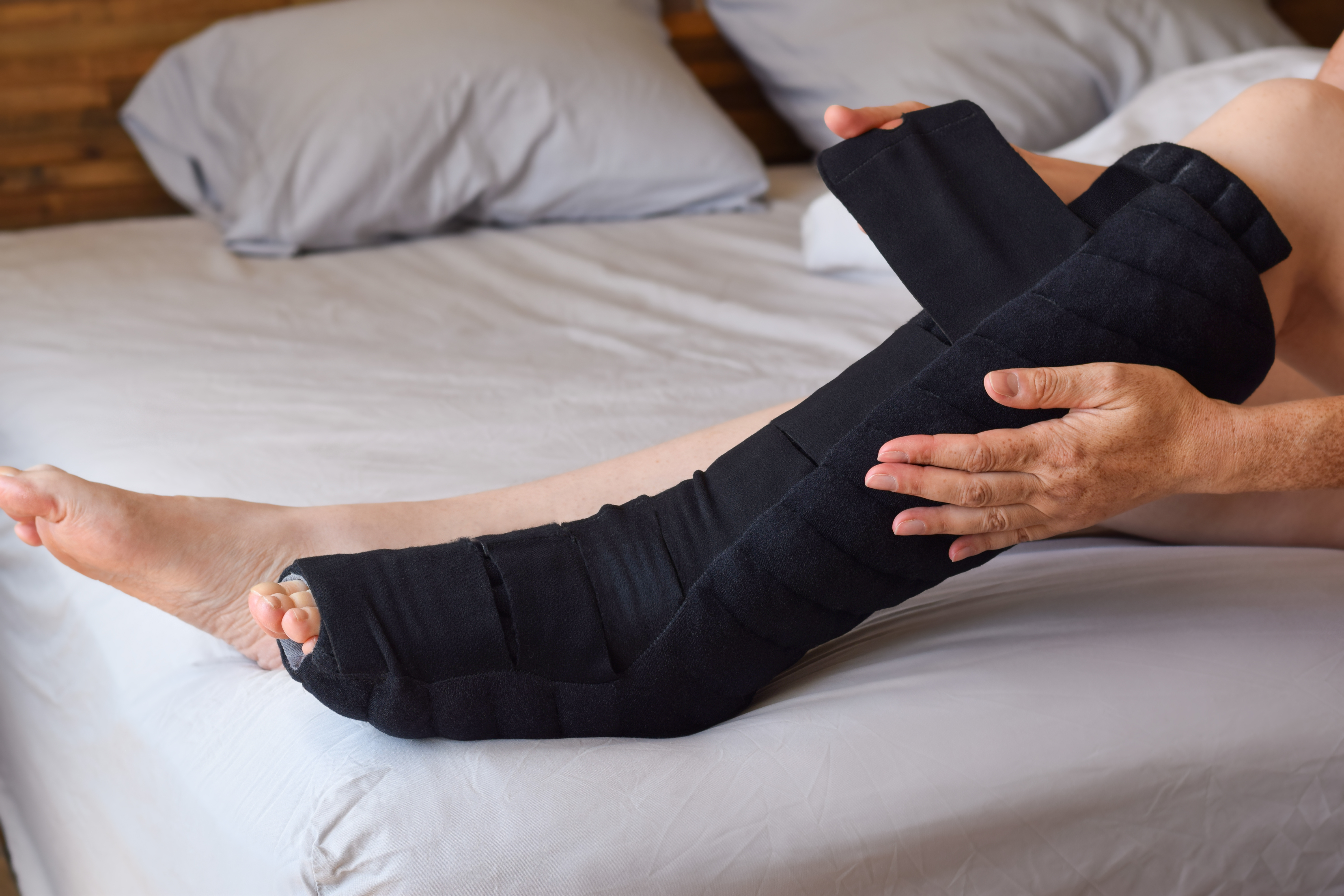 Image of a person re-adjusting compression wrap